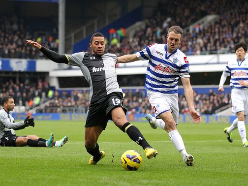 Mousa Dembele and Clint Hill battle for the ball