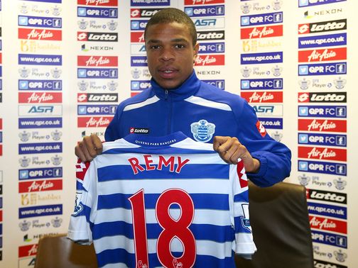 Loic Remy poses with his new QPR shirt.