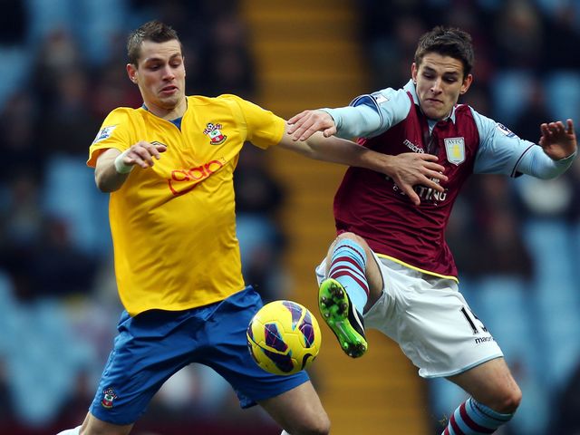 Mogan Schneiderlin and Ashley Westwood battle for possession