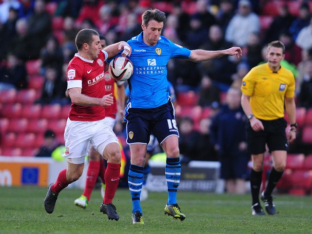 Dawson and Tonge battle for possession