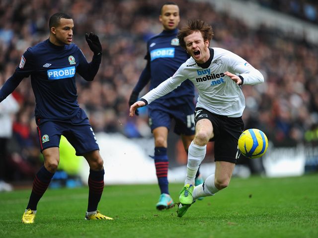 Martin Olsson and John Bayford battle for the ball