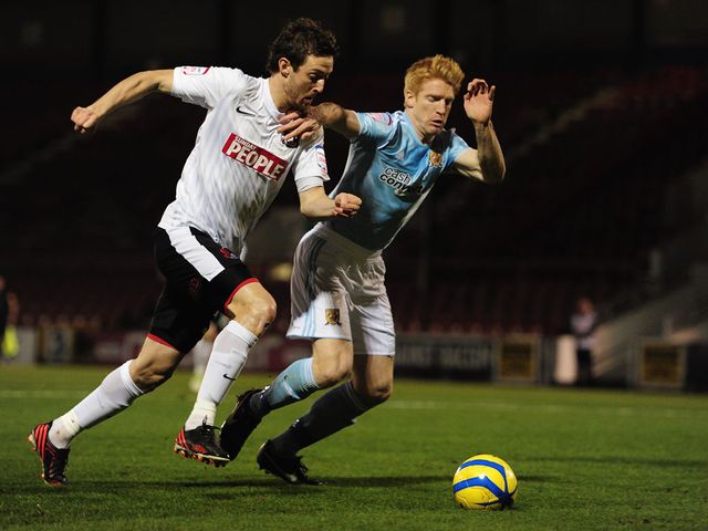 David Mooney tries to get past Paul McShane