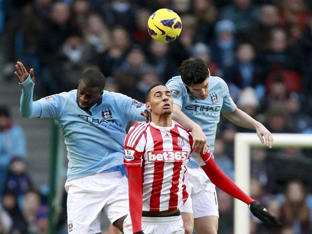 Nzonzi jumps with Toure and Barry