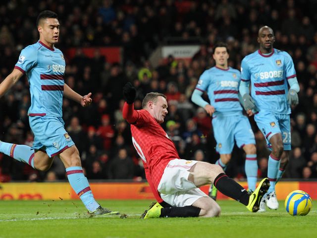 Rooney slides home to give Man United the win.