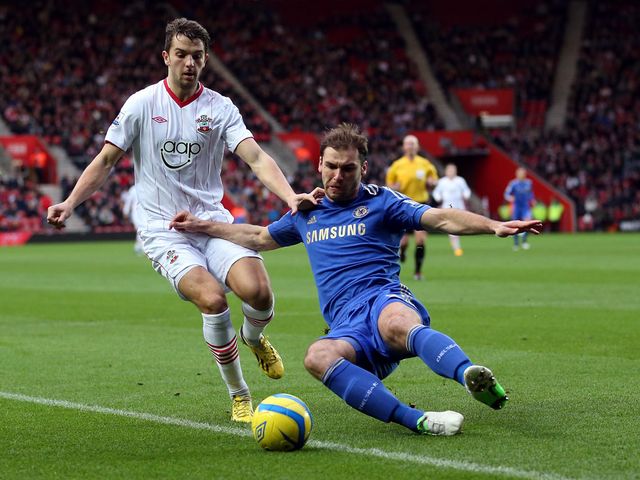 Jay Rodriguez is tackled by Branislav Ivanovic