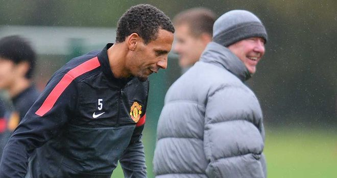Rio Ferdinand (left) and Sir Alex Ferguson at a Manchester United training session