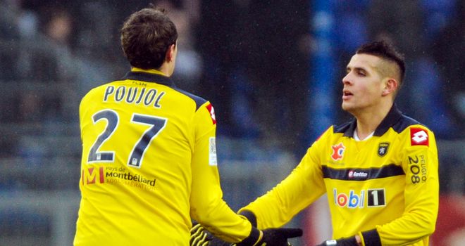 Loic Poujol (l) celebrates his vital goal