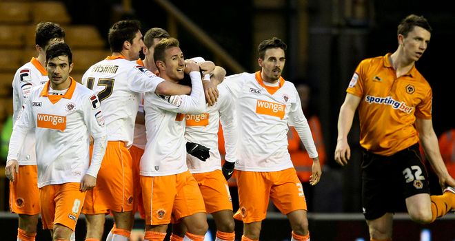 Tom Ince: Mobbed after brilliant two-goal display earned Blackpool victory