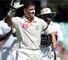 Mike Hussey waves to the crowd as he exits the Test arena for the final time