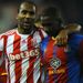 Scorer of Stoke's fourth goal Cameron Jerome consoles Yannick Bolasie
