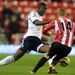 Midfielder Jack Colback vies for the ball with Benik Afobe at the Stadium of Light