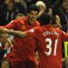 Sterling celebrates with Luis Suarez, scorer of Liverpool's second