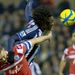 Belgian forward Romelu Lukaku gets above QPR defender Clint Hill to win the ball