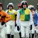The jockeys emerge for the opener...
