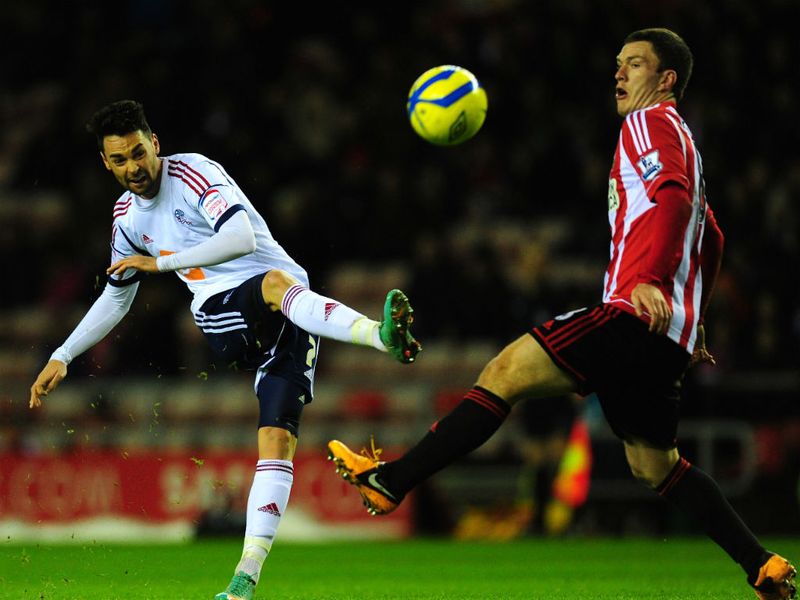 Bolton's Chris Eagles gets in a shot at goal despite the attentions of Craig Gardner