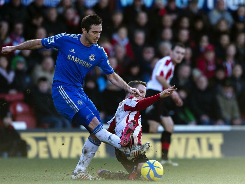 Giving thier all: Frank Lampard vies for the ball with Adam Forshaw