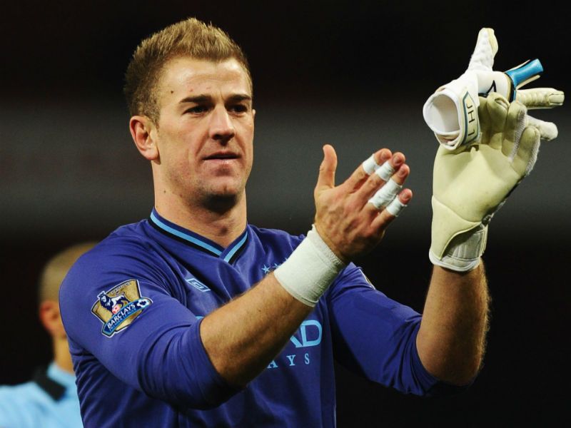 Great support: Joe Hart applauds the travelling fans after the final whistle as City reduce Manchester United's lead at the top back to seven points