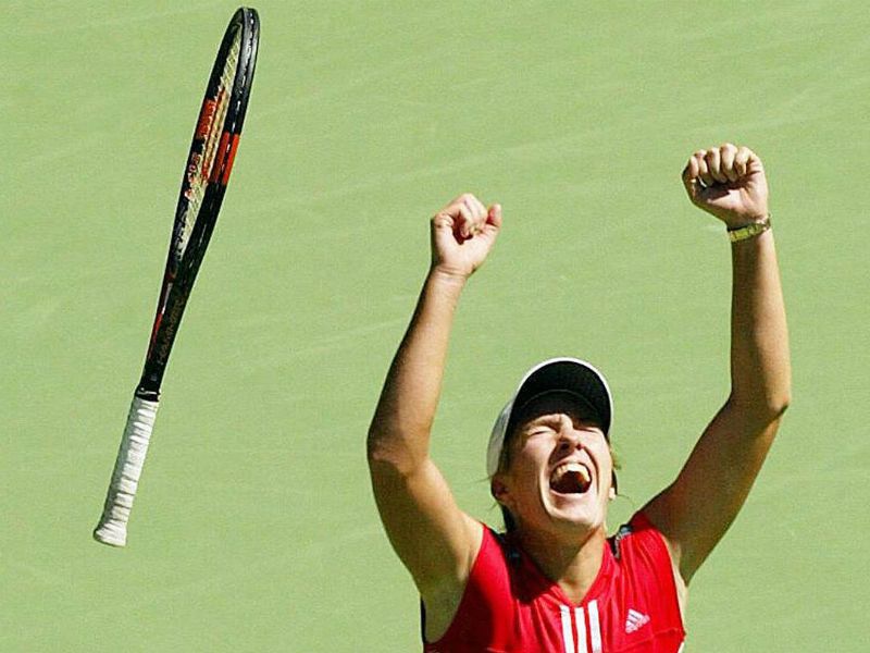 All smiles: There was a different outcome in 2004 when Henin beat compatriot Kim Clijsters