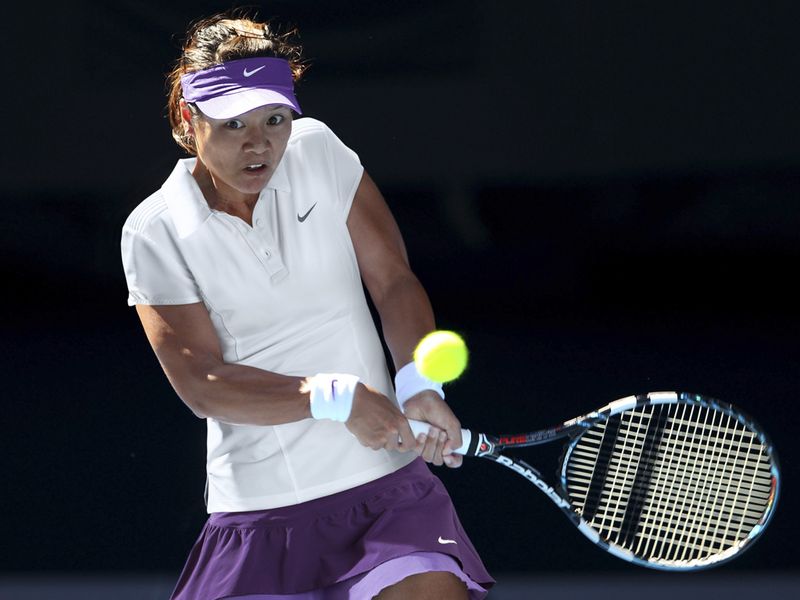 Li Na goes for her usual top and skirt combo - her top features a three-button placket and pintucks at the shoulder