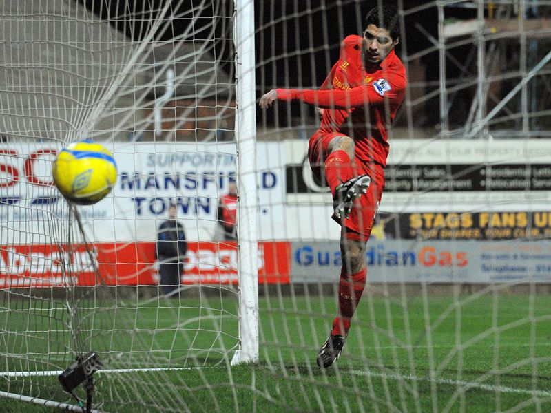 ...Suarez shoots, the ball rebounds back off his hand and falls to him in front of an empty net. 2-0 to the Anfield club.