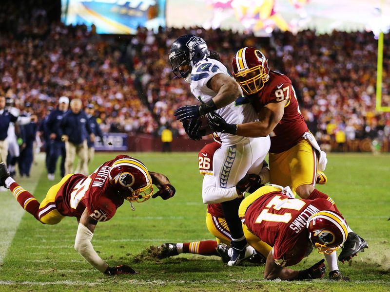 Marshawn Lynch atones for a fumble earlier in the game by rumbling over from 27 yards out in the fourth quarter.