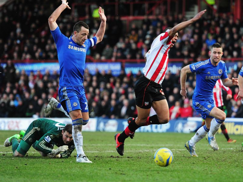 Penalty awarded: Tom Adeyemi of Brentford is fouled by Ross Turnbull the Chelsea goalkeeper for a spot-kick...