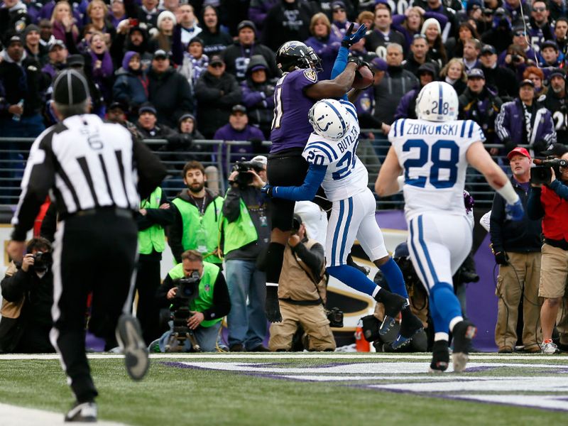 Anquan Boldin holds on for the touchdown that sealed the Ravens' 24-9 victory.