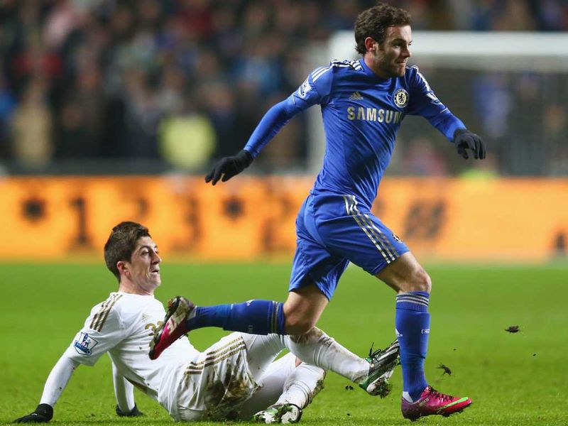 Juan Mata leaves Pablo Hernandez behind as he gets forward for Chelsea during the first half.