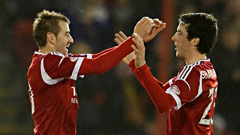 Niall McGinn: Celebrates his fine winner for Aberdeen