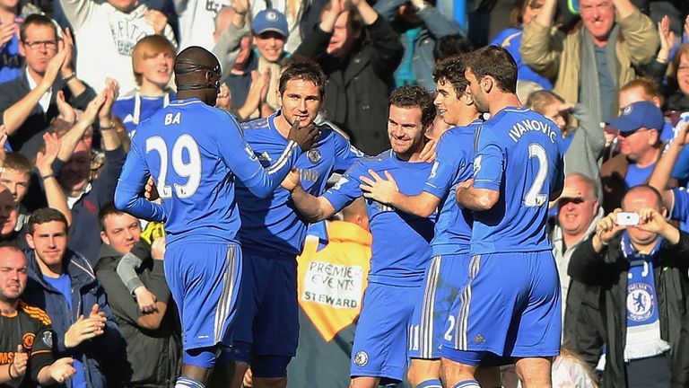 Juan Mata: Celebrates after opening the scoring at Stamford Bridge
