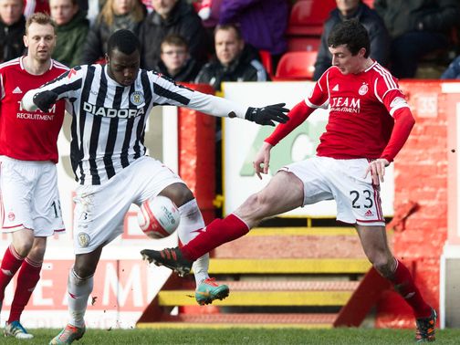 Esmael Goncalves and Joe Shaughnessy battle for the ball