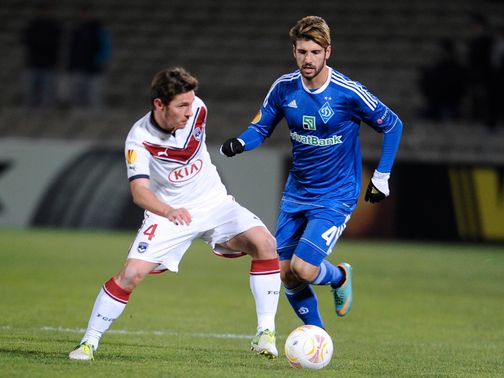 Ludovic Obraniak and Miguel Veloso battle for the ball