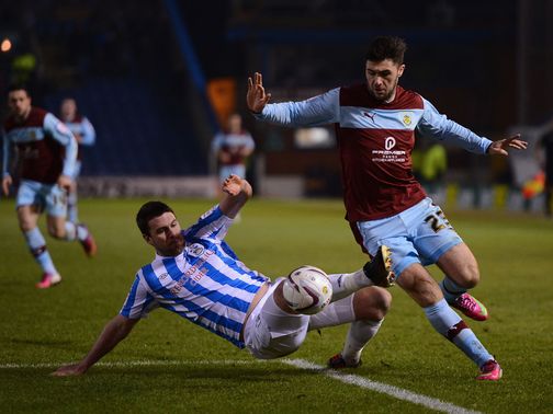 Anthony Gerrard tackles Burnley's Charlie Austin
