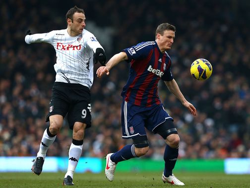 Robert Huth tries to hold off Dimitar Berbatov