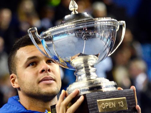 Jo-Wilfried Tsonga with the spoils of victory