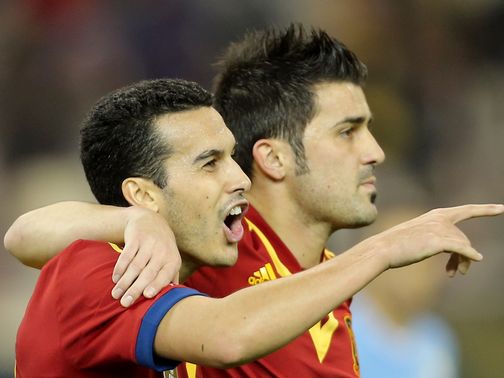 Pedro Rodriguez and David Villa celebrate for Spain