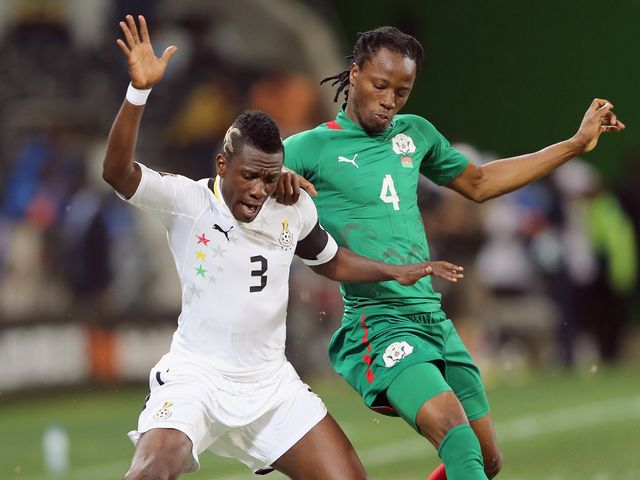 Gyan looks to hold the ball up for Ghana