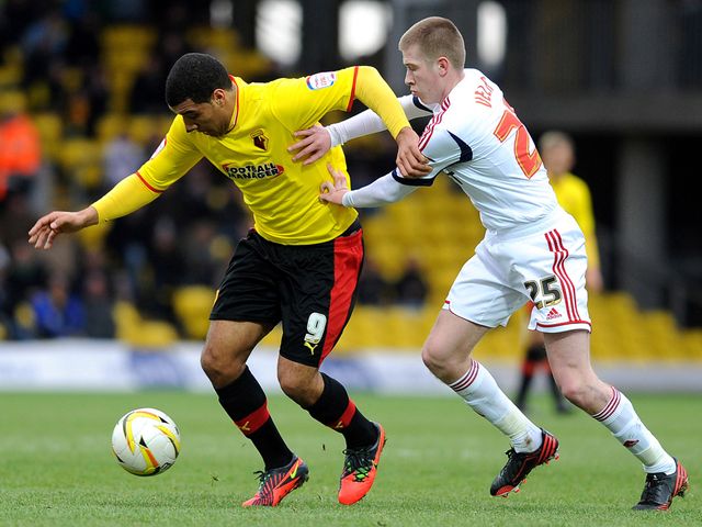 Troy Deeney bids to find space.