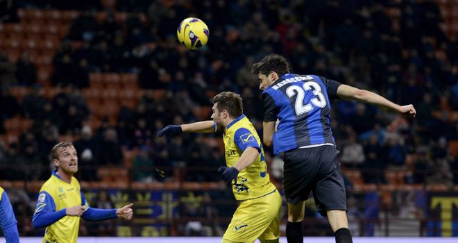 Andrea Ranocchia heads home for Inter.