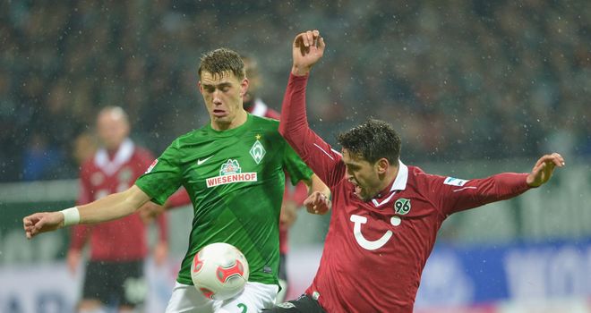 Nils Petersen (left) challenges for the ball