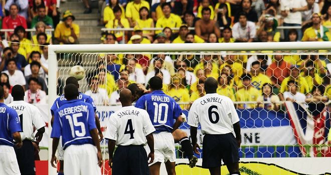 Ronaldinho's free-kick drops into the England net at the 2002 World Cup