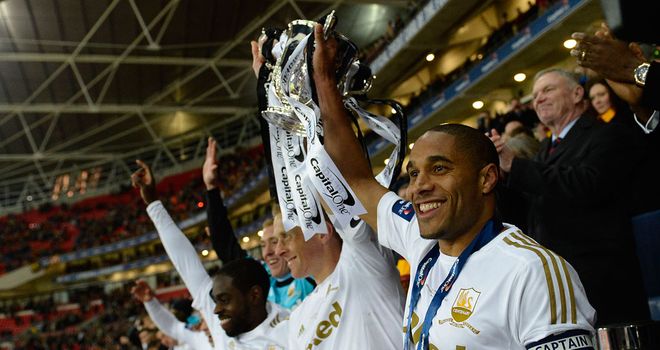 Swansea lift last year's Capital One Cup after beating Bradford