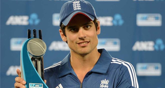 Alastair Cook poses with a new trophy for the England cabinet