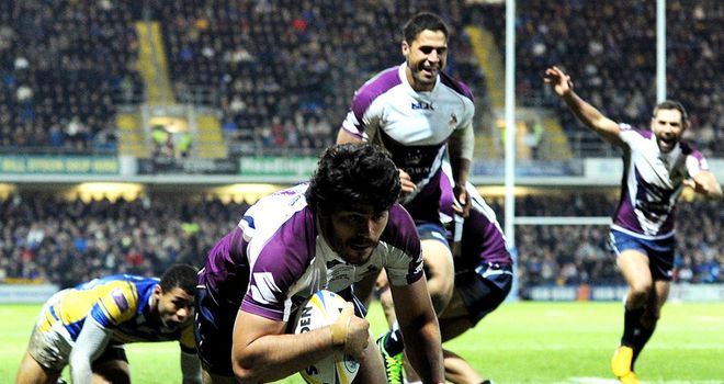 Melbourne celebrate a try on the way to victory over Leeds