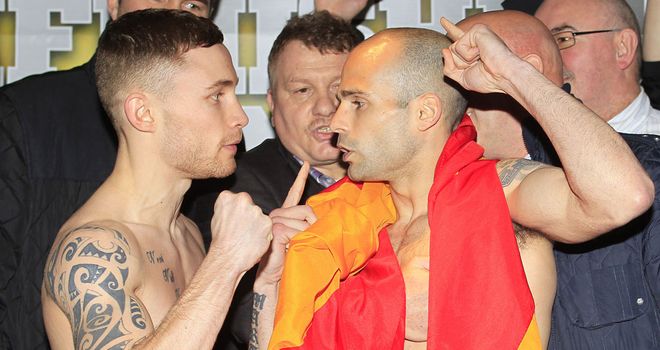 Carl Frampton (L) and Kiko Martinez kick-off at the weigh-in