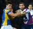 Joel Moon tangles with Melbourne's Cameron Smith