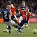 Millwall defender Alan Dunne vies with Luton midfielder JJ ODonnell