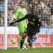 Maynor Figueroa celebrates Wigan's first goal in their crunch clash at Reading although it was given to Arouna Kone
