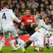 Real Madrid defender Raphael Varane challenges Manchester United striker Robin van Persie