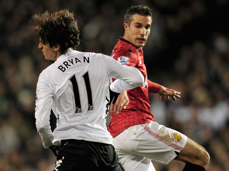 Robin van Persie tangles for the ball with Bryan Ruiz as United strive to break the deadlock.